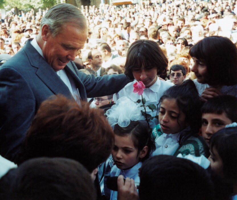(Photo courtesy Huntsman family) Jon Huntsman visits with children in Gyumri, Armenia, in October 2000.