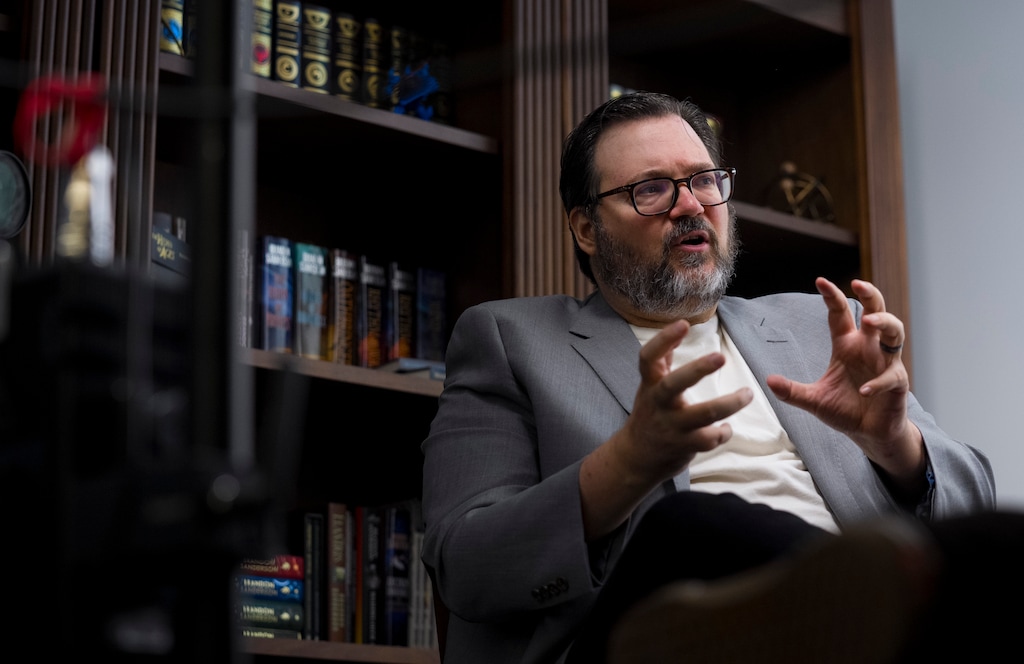 (Bethany Baker  |  The Salt Lake Tribune) Brandon Sanderson, a popular fantasy author based out of Utah, speaks during an interview at the headquarters for his company Dragonsteel Entertainment in Pleasant Grove on Thursday, July 16, 2026. Two of his fantasy book series are being adapted for the screen. 
