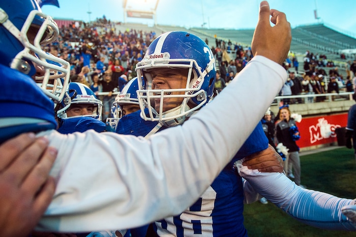 Chris Detrick | The Salt Lake Tribune
Bingham's Cole Moody (38) celebrates with his teammates after winning the 5A football championship at Rice-Eccles Stadium Friday November 18, 2016. Bingham defeated Lone Peak 17-10.