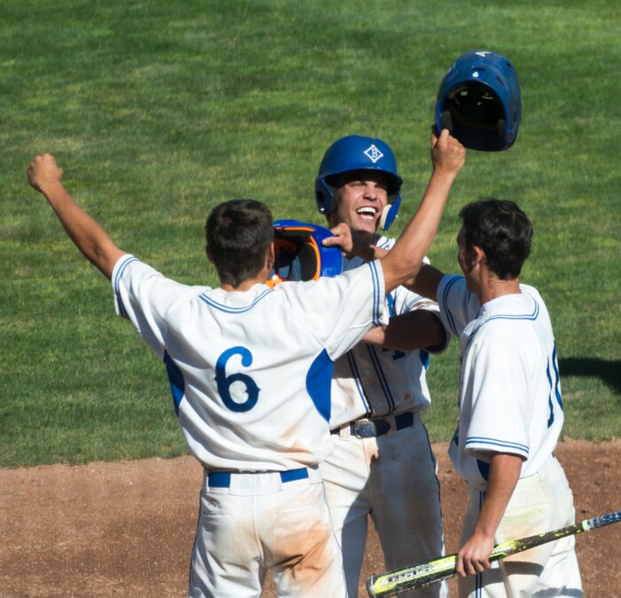 (Rick Egan  |  The Salt Lake Tribune)  The Bingham Miners Tyler Kemp (6) and Nick Stevens (10) celebrate a 3-run homer by Noah Wallick (4), in 6A state baseball State Championship game, at UVU in Orem, Friday, May 25, 2018.