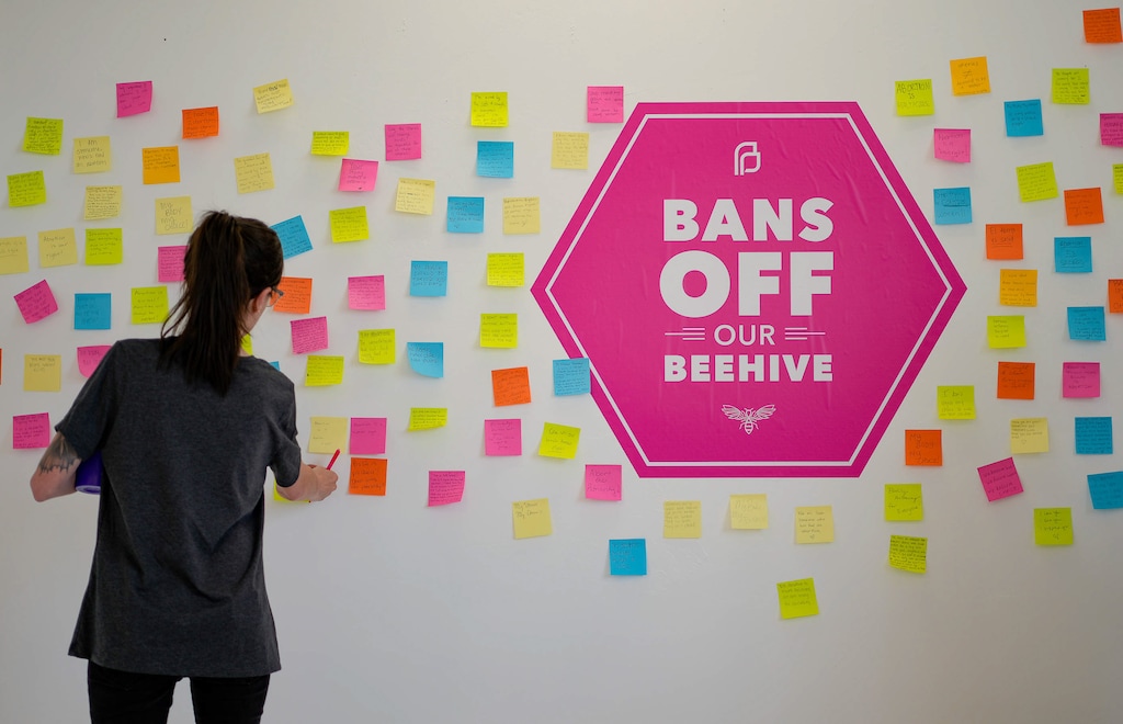 (Francisco Kjolseth | The Salt Lake Tribune) People add their thoughts to a wall of a new art exhibit entitled Bans Off Our Beehive, hosted by Planned Parenthood Association of Utah showcasing artwork created by people about their abortions at Medium Studio in Sugarhouse on Friday, May 13, 2022. The Utah Attorney General's office has asked the state Supreme Court for permission to appeal the current hold on Utah's trigger law.