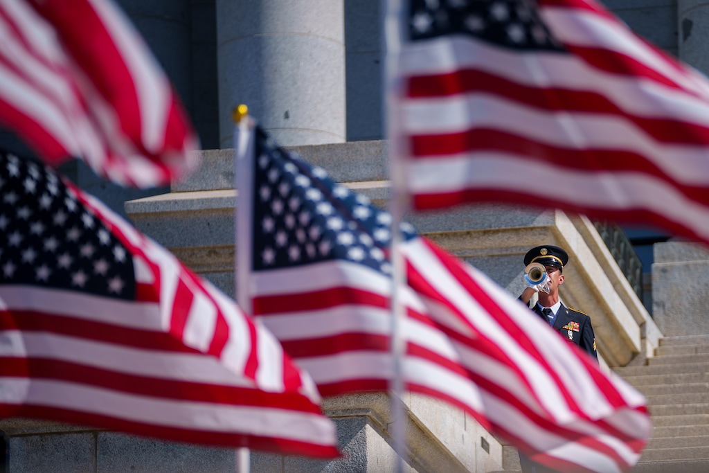 (Trent Nelson  |  The Salt Lake Tribune) Sgt. Aaron Reynolds performs taps to honor veterans during a service at the State Capitol in Salt Lake City on Monday, May 31, 2021.