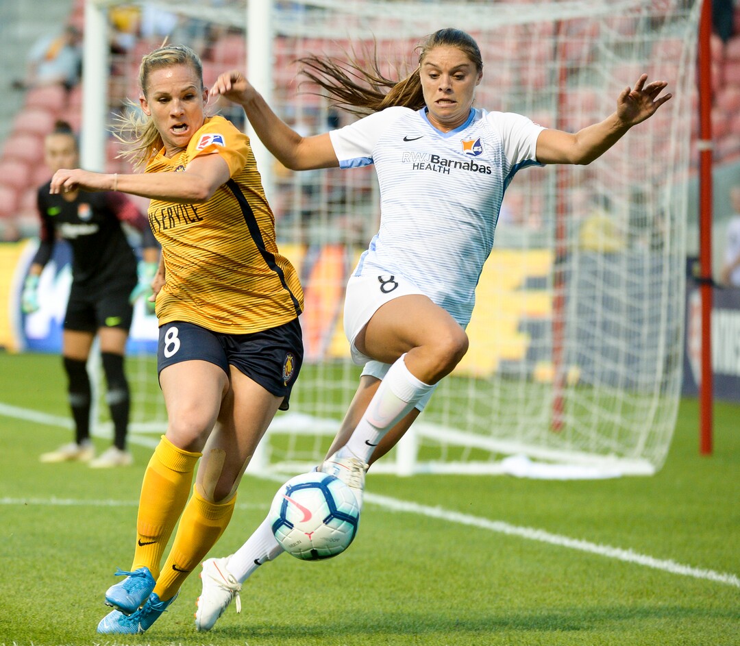 (Leah Hogsten  |  The Salt Lake Tribune) Utah Royals FC forward Amy Rodriguez (8) fights Sky Blue FC defender Erica Skroski (8) to the ball as the Utah Royals FC host Sky Blue FC, August 7, 2019 at Rio Tinto Stadium.