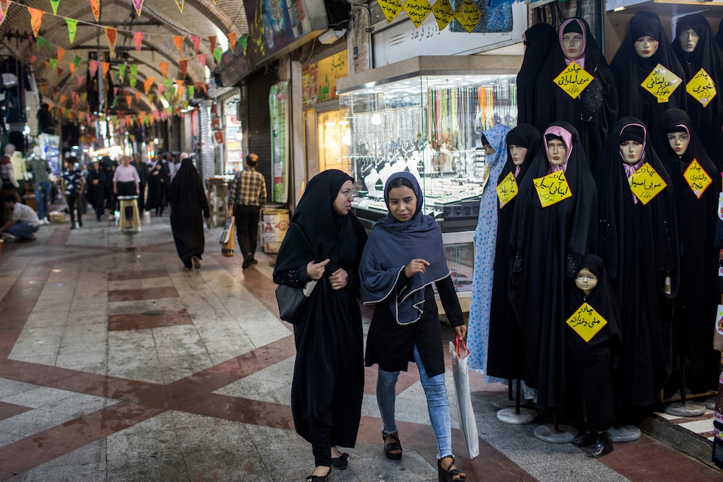 (Arash Khamooshi | The New York Times)
Two women walk through a bazaar in Tehran, Iran, April 30, 2018.