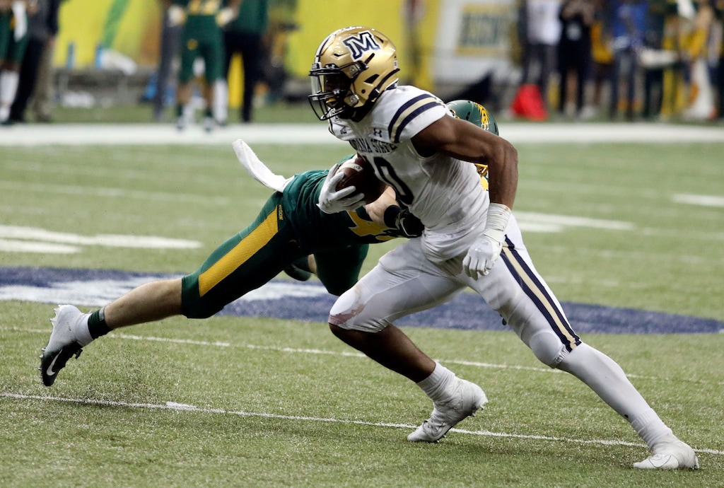 Montana State wide receiver Travis Joneson (10) slips by a North Dakota State defender during the second half of an FCS playoff NCAA college football game against Montana State, Saturday, Dec. 21, 2019, in Fargo, N.D. (AP Photo/Bruce Crummy)