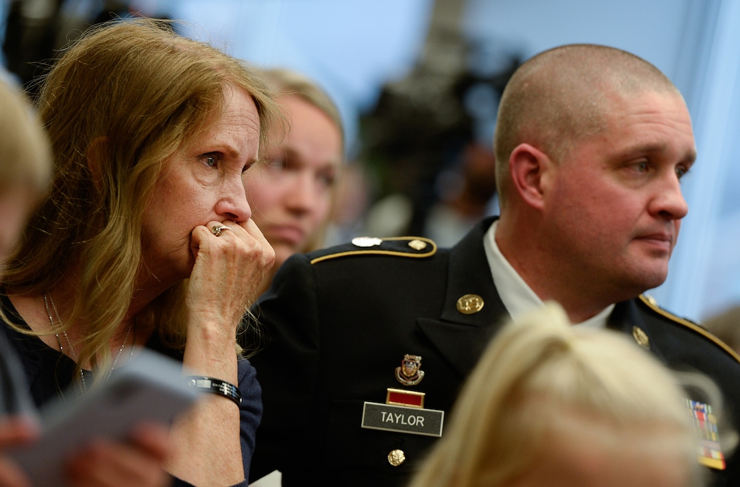 (Francisco Kjolseth  |  The Salt Lake Tribune)  Major Brent Taylor's mother Tammy Taylor and her son Matthew, Brent's older brother, are moved by the vocal trio Gentri as they perform "One" as Brigham Young University honors the life and legacy of Major Brent Taylor, former mayor of North Ogden and a BYU Army ROTC alumnus during a ceremony at the Ernest L. Wilkinson Student Center in Provo on Thursday, May 23, 2019. The BYU Army ROTC updated their Memorial Wall, now containing 211 names of BYU students and alumni who have died in service.