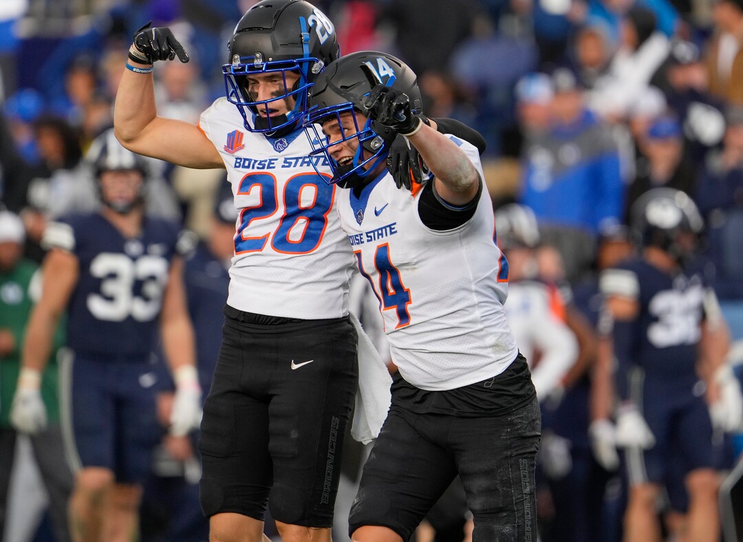(Leah Hogsten | The Salt Lake Tribune) Boise State Broncos cornerback Kaonohi Kaniho (14) celebrates his interception with Boise State Broncos cornerback Kekaula Kaniho (28) as No. 10 Brigham Young University hosts Boise State at LaVell Edwards Stadium, Oct. 9, 2021.