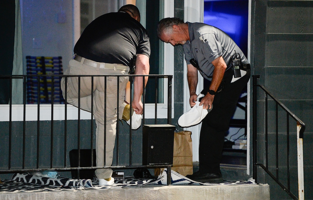 (Francisco Kjolseth  |  The Salt Lake Tribune)  Police investigators search a home at 547 N. 1000 West in Salt Lake City as part of the disappearance of University of Utah student MacKenzie Lueck on Wed. June 26, 2019.