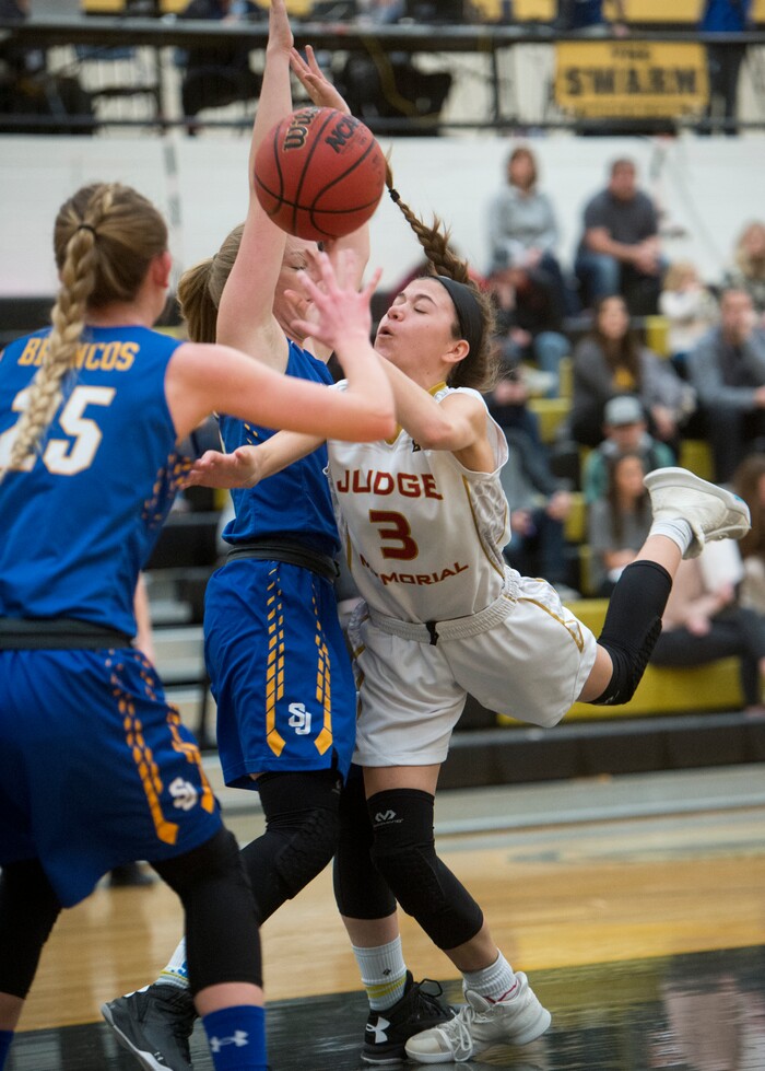 (Rick Egan  |  The Salt Lake Tribune)   Isabella Jones (3) is stopped by San Juan defenders, as she attempts a lay up, in 3A Women's basketball playoff action Judge Memorial Vs. San Juan, in Heber City, Friday, Feb. 16, 2018.