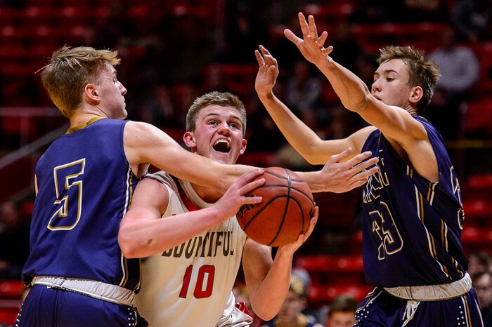 (Trent Nelson | The Salt Lake Tribune)  Skyline vs. Bountiful, 5A State high school basketball tournament at the Huntsman Center in Salt Lake City, Wednesday Feb. 28, 2018. Bountiful's Brig Willard (10) moves between Skyline's Hollan Schweitz (5) and Skyline's Tim Lont (33).