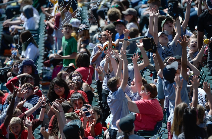 (Francisco Kjolseth  |  The Salt Lake Tribune)  Kids cheer are showered with silly string at Smith's Ballpark on Thursday, May 2, 2019 for the staging of their annual kids day baseball game.