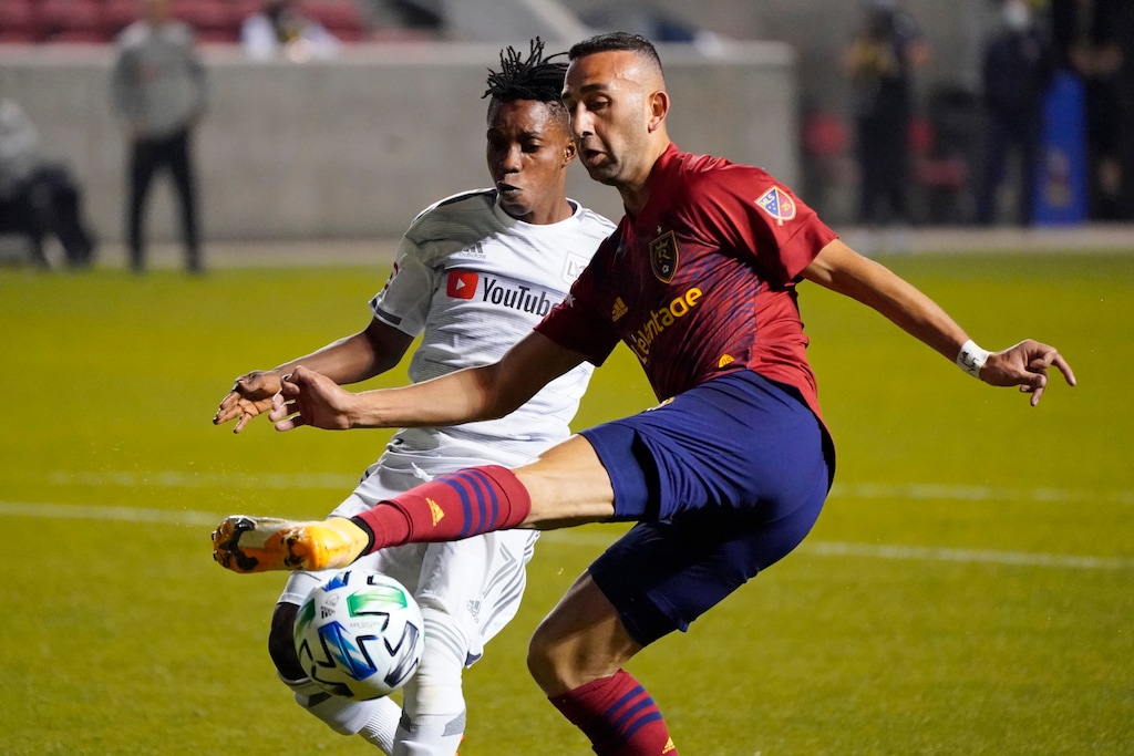 Los Angeles FC forward Latif Blessing, left, and Real Salt Lake forward Justin Meram go for the ball during the first half of an MLS soccer match Sunday, Oct. 4, 2020, in Sandy, Utah. (AP Photo/Rick Bowmer)