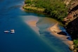 (Trent Nelson  |  The Salt Lake Tribune) Rafts on the Colorado River as seen from Navajo Bridge in Ariz. on Tuesday, May 20, 2025.