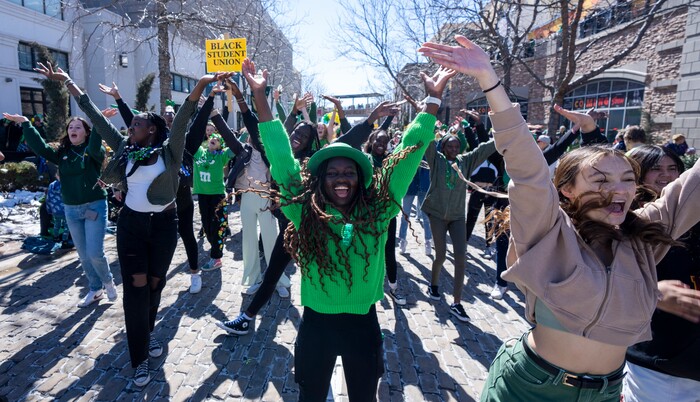 (Rick Egan | The Salt Lake Tribune) Students from Judge Memorial Catholic High School dance in the Saint Patrick's Parade at the Gateway in Salt Lake City, on Saturday, March 12, 2022.