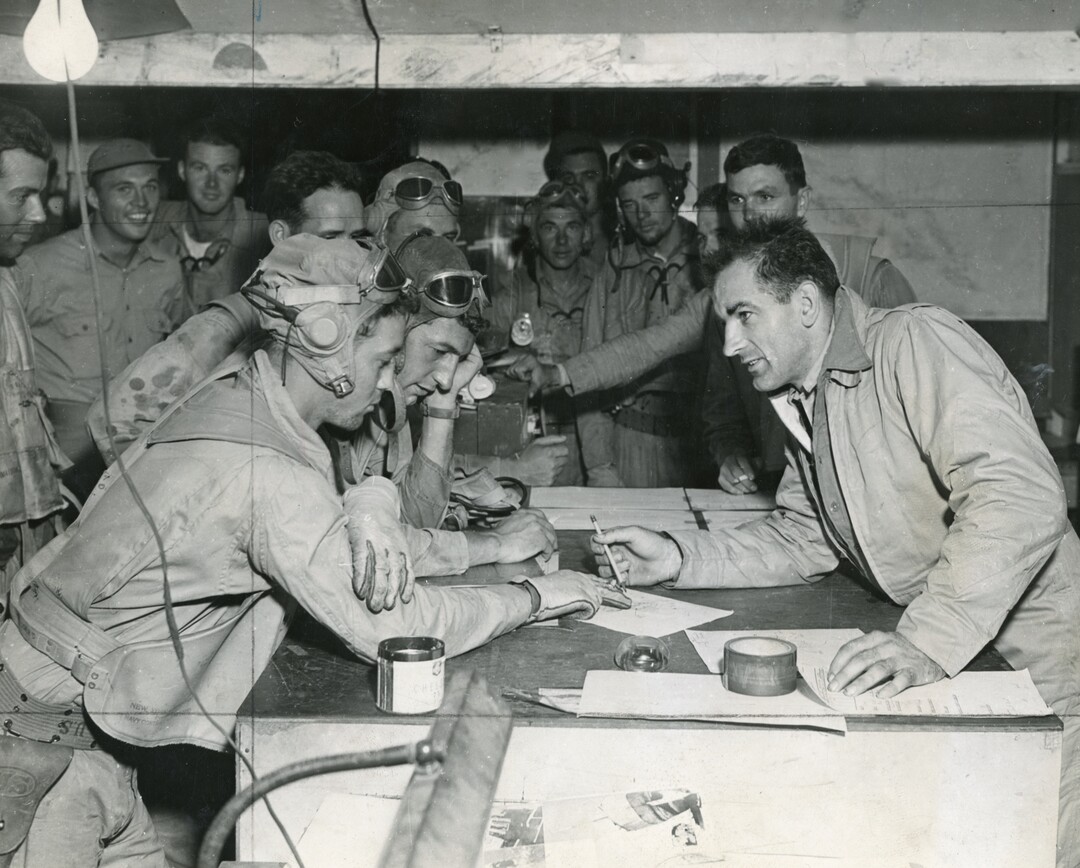 (Photo courtesy of the Wisconsin Historical Society) Joseph McCarthy interviews pilots who just returned from raids on Japanese installations in the Solomon Islands during World War II.
