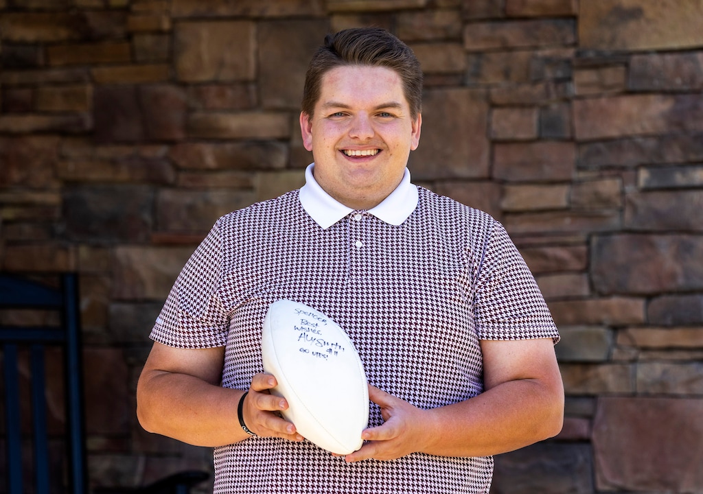 (Rick Egan | The Salt Lake Tribune) Spencer Hunt with the football signed by Alex Smith, at his home in North Salt Lake, on Thursday, April 22, 2021.