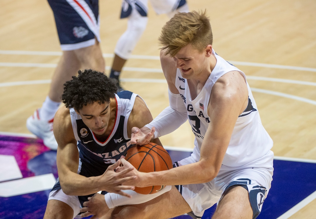 (Rick Egan | The Salt Lake Tribune)  Gonzaga Bulldogs guard Andrew Nembhard (3) goes after the ball along with Brigham Young Cougars forward Matt Haarms (3), in West Coast Conference Basketball action between the Brigham Young Cougars and the Gonzaga Bulldogs at the Marriott Center in Provo, on Monday, Feb. 8, 2021.