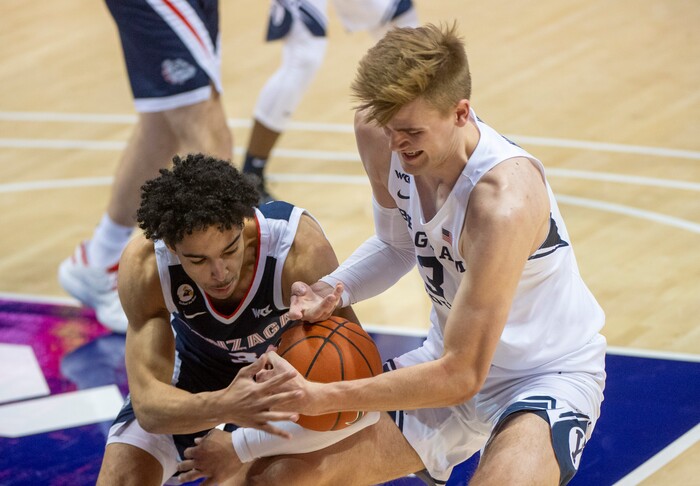 (Rick Egan | The Salt Lake Tribune)  Gonzaga Bulldogs guard Andrew Nembhard (3) goes after the ball along with Brigham Young Cougars forward Matt Haarms (3), in West Coast Conference Basketball action between the Brigham Young Cougars and the Gonzaga Bulldogs at the Marriott Center in Provo, on Monday, Feb. 8, 2021.
