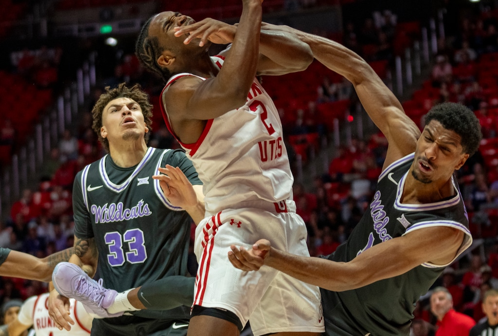 (Rick Egan | The Salt Lake Tribune)  Utah Utes forward Ezra Ausar (2) tales a shot, as Kansas State Wildcats guard C.J. Jones (3) defends, and Kansas State Wildcats guard Coleman Hawkins (33) looks on, in Big 12 basketball action between the Utah Utes and the Kansas State Wildcats, at the Jon M. Huntsman Center in Salt Lake City on Monday, Feb. 17, 2025. 