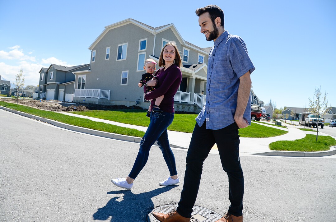 (Francisco Kjolseth  |  The Salt Lake Tribune)  Ember and Jeremy Ulrich take their daughter Jemma, 1, for a walk around their newly developed neighborhood in Lehi after moving there from Pleasant Grove last October. Along with some friends who were also looking to get more house for their money and ended up moving in next door, Jeremy wanted to be closer to his job at Adobe in Lehi.