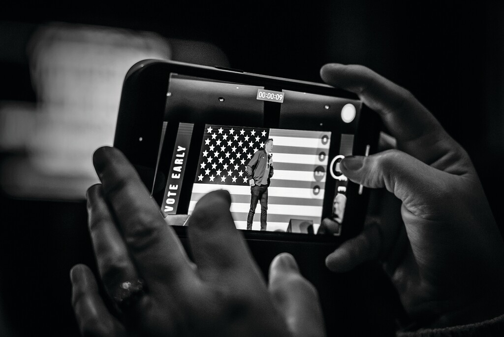 FILE — An attendee takes a video of Elon Musk speaking at a rally in Lancaster, Pa., Oct. 26, 2024. (Mark Peterson/The New York Times)