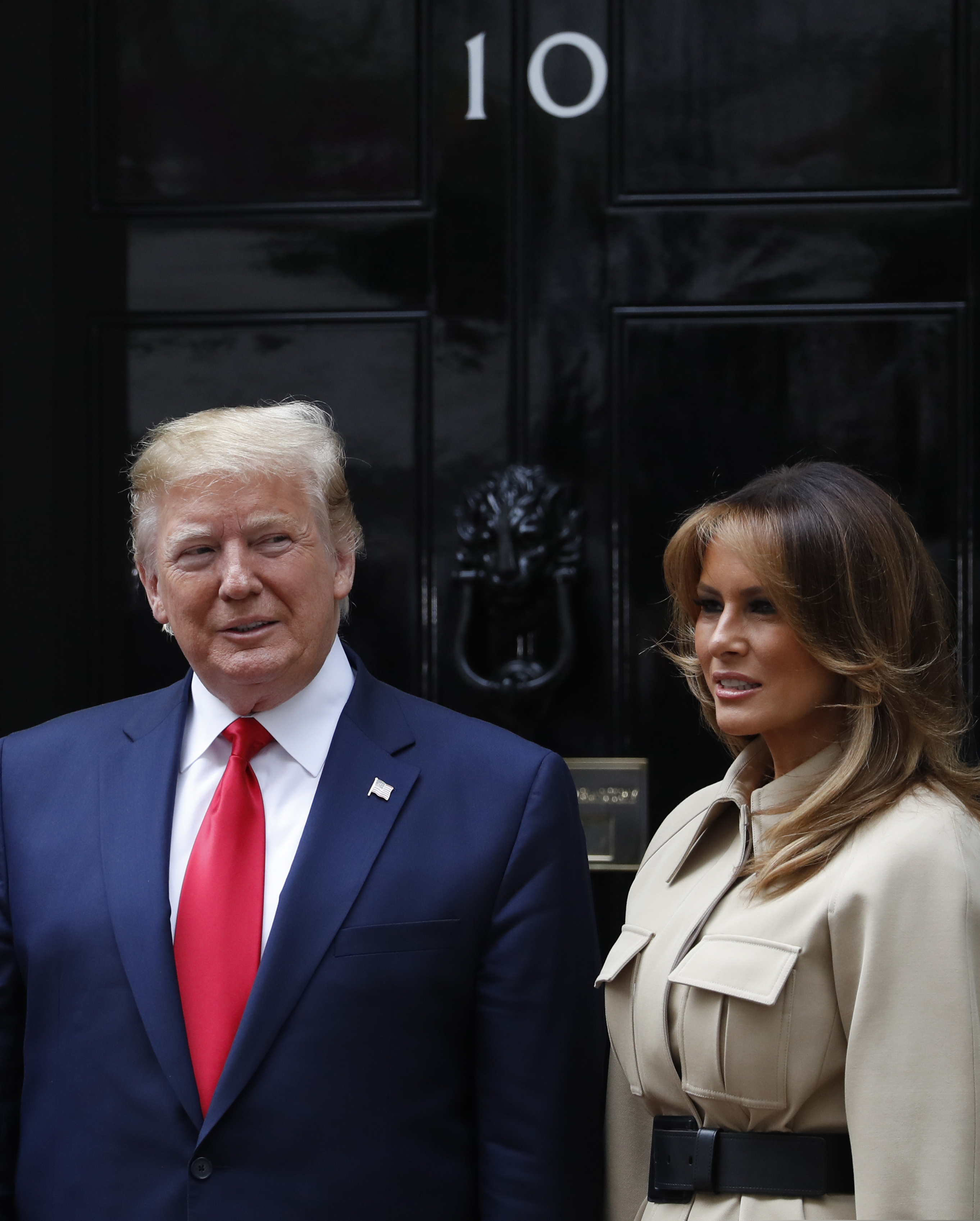 President Donald Trump and first lady Melania arrives at 10 Downing Street in central London to meet with Britain's Prime Minister Theresa May on Tuesday, June 4, 2019. President Donald Trump will turn from pageantry to policy Tuesday as he joins British Prime Minister Theresa May for a day of talks likely to highlight fresh uncertainty in the allies' storied relationship. (AP Photo/Alastair Grant)