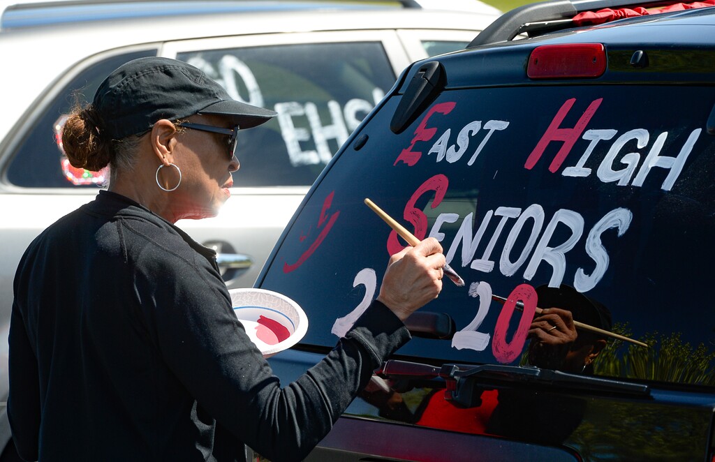 (Francisco Kjolseth | Tribune file photo) East High school special education teacher Myra Waters gets ready to head out with one of several teams to visit each of the over 400 students of the 2020 graduating class on Thursday, May 7, 2020, as a way to celebrate them during this challenging time of the coronavirus pandemic.