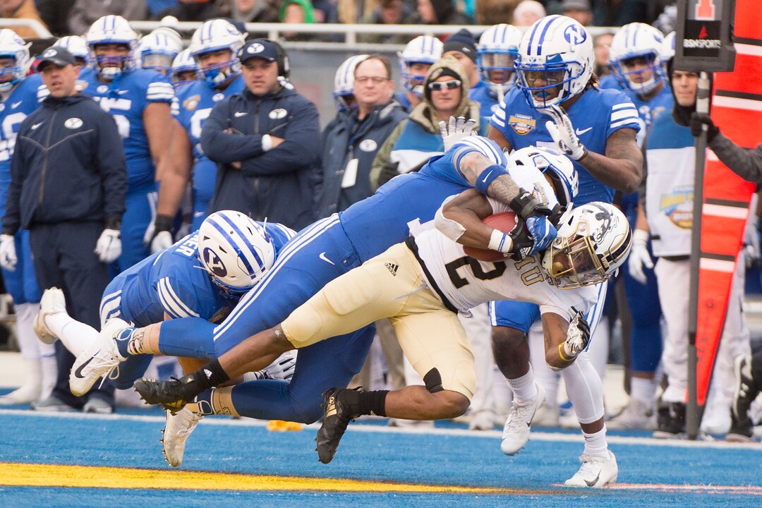 (Jeremy Harmon  |  The Salt Lake Tribune) Western Michigan Broncos running back LeVante Bellamy (2) is tackled by Brigham Young Cougars linebacker Sione Takitaki (16) as BYU faces the Western Michigan Broncos in the Famous Idaho Potato Bowl in Boise, Idaho, on Friday, Dec. 21, 2018.