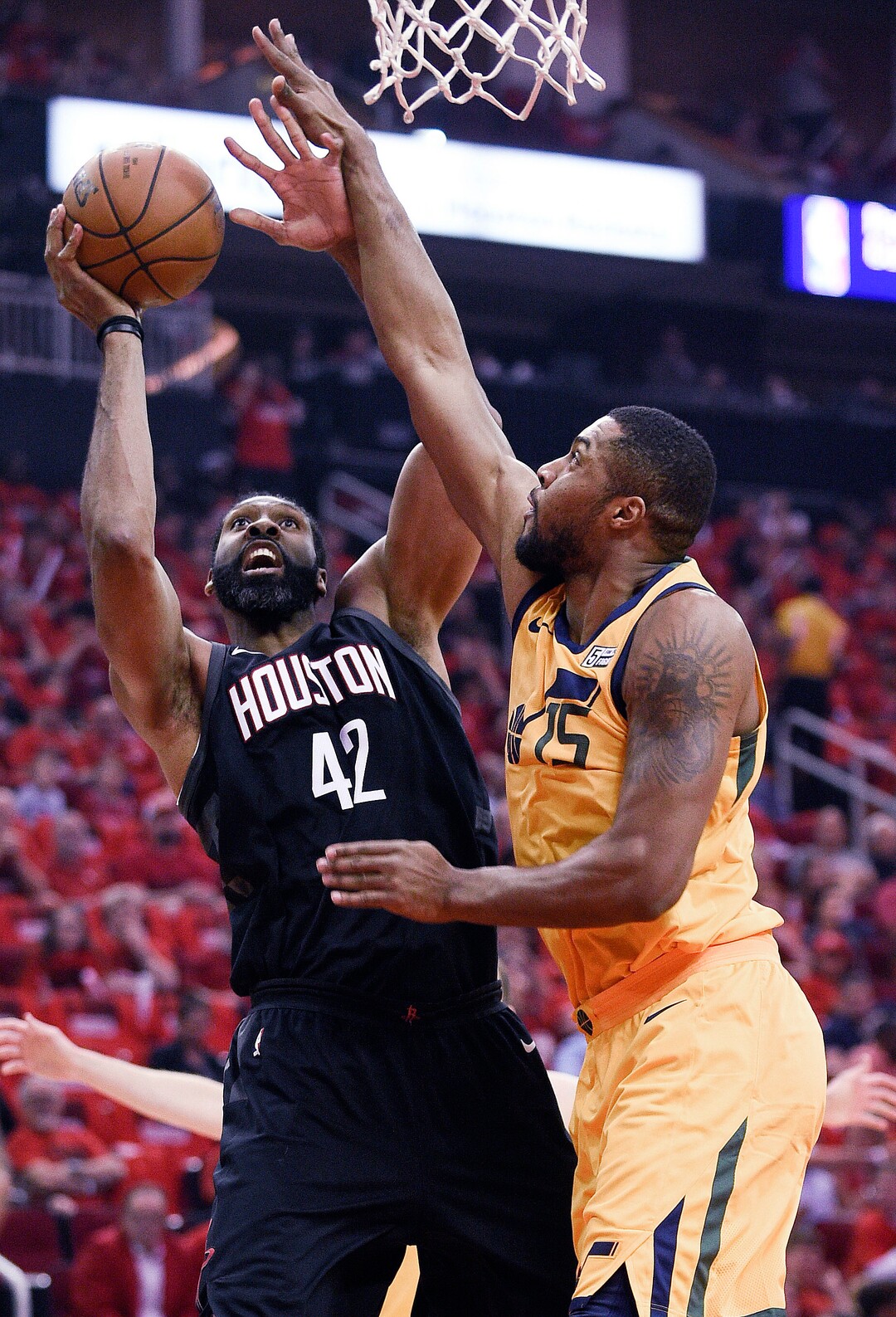 Houston Rockets center Nene Hilario (42) shoots as Utah Jazz forward Derrick Favors defends during the first half in Game 1 of an NBA basketball second-round playoff series, Sunday, April 29, 2018, in Houston. (AP Photo/Eric Christian Smith)