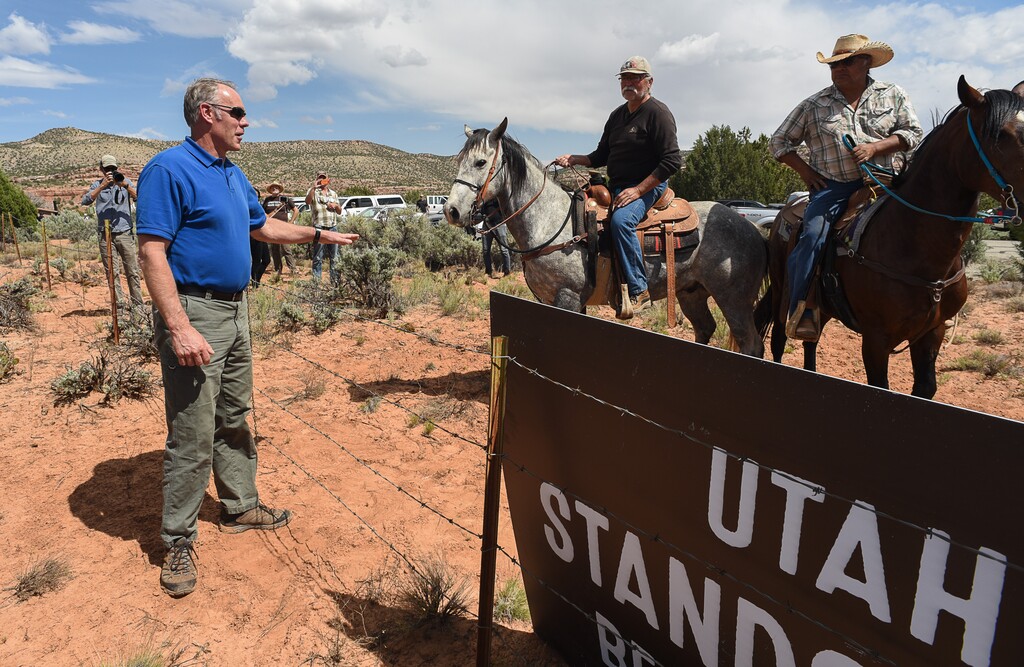 (Francisco Kjolseth | Tribune file photo)
Interior Secretary Ryan Zinke speaks with Willy Grayeyes, center, and Leroy Teeasyaton of Utah Dine Bikeyah following a short hike to Butler Wash Indian Ruins by the secretary and members of the Utah delegation during a tour of the Bears Ears National Monument on Monday, May 8, 2017.