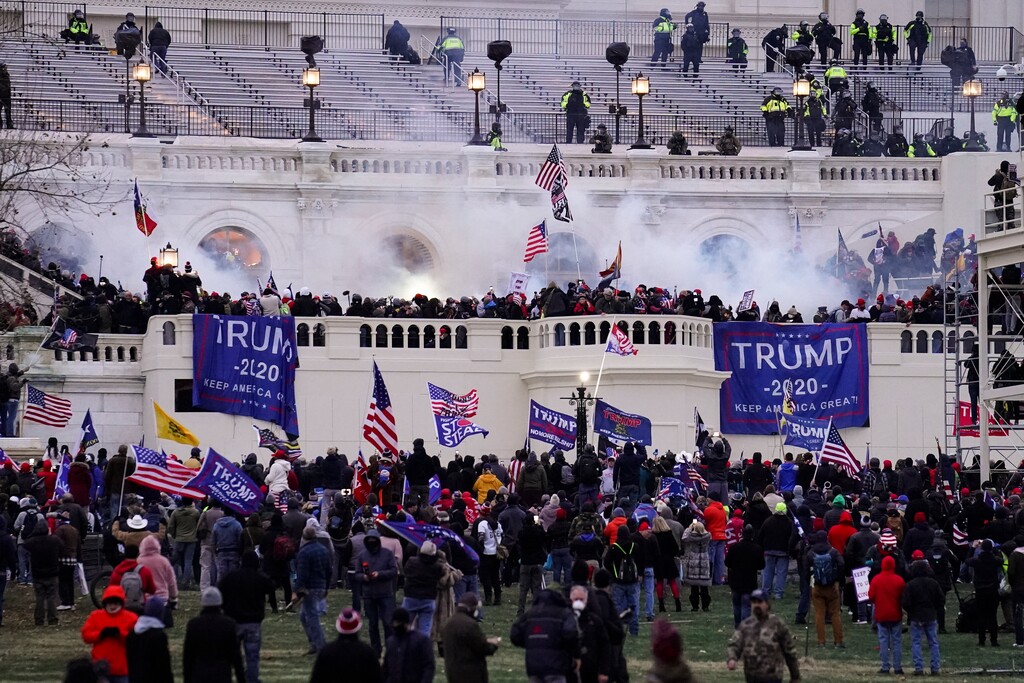 John Minchillo | AP Photo) In this Jan. 6, 2021, photo violent rioters, loyal to President Donald Trump, storm the Capitol in Washington.