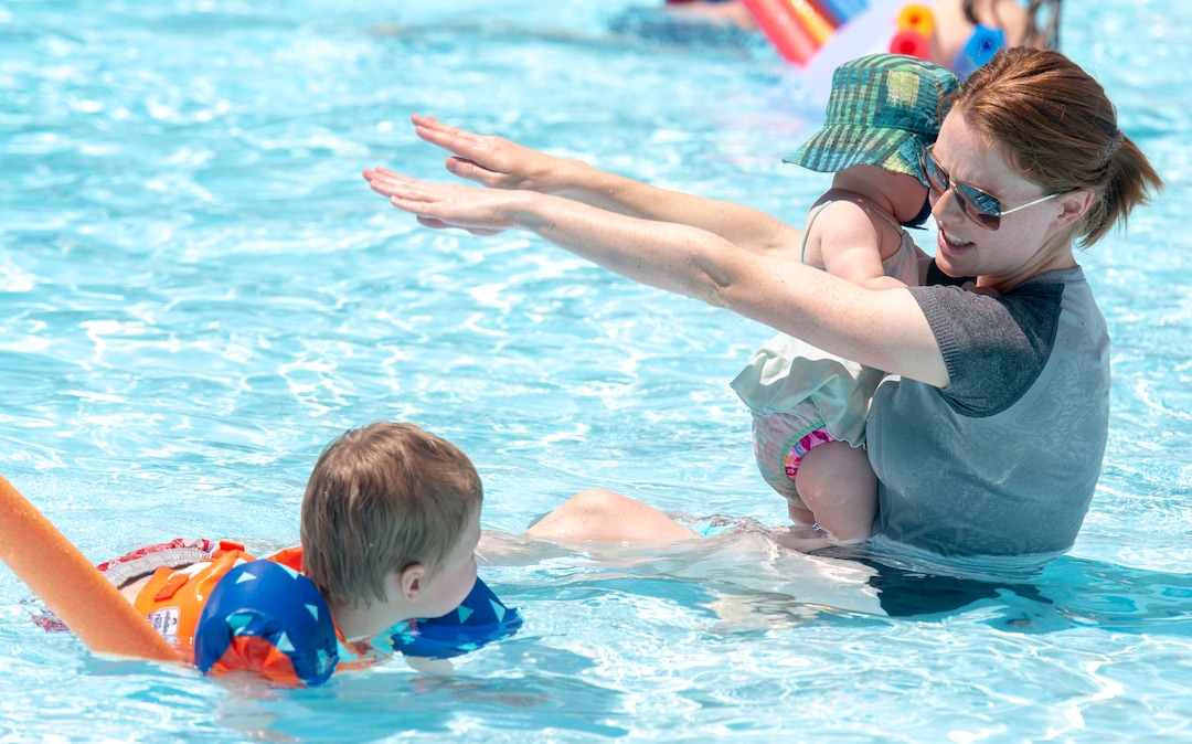 (Rick Egan  |  The Salt Lake Tribune)    Kaitlyn Curtis swims with Ada and Theo at the Jewish Community Center, May 31, 2019