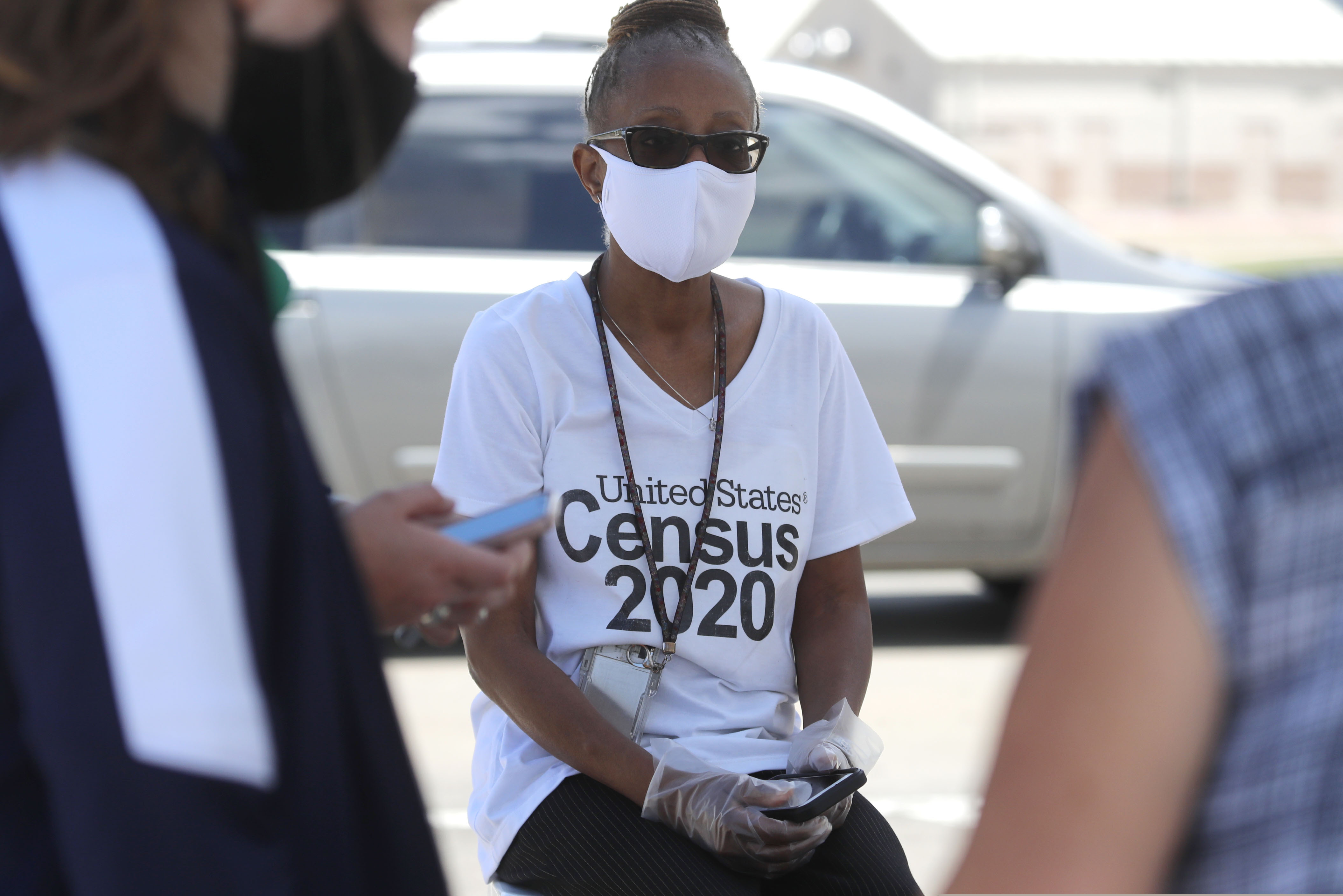 (LM Otero | AP photo)

Amid concerns of the spread of COVID-19, census worker Jennifer Pope wears a mask and sits by ready to help at a U.S. Census walk-up counting site set up for Hunt County in Greenville, Texas, Friday, July 31, 2020.