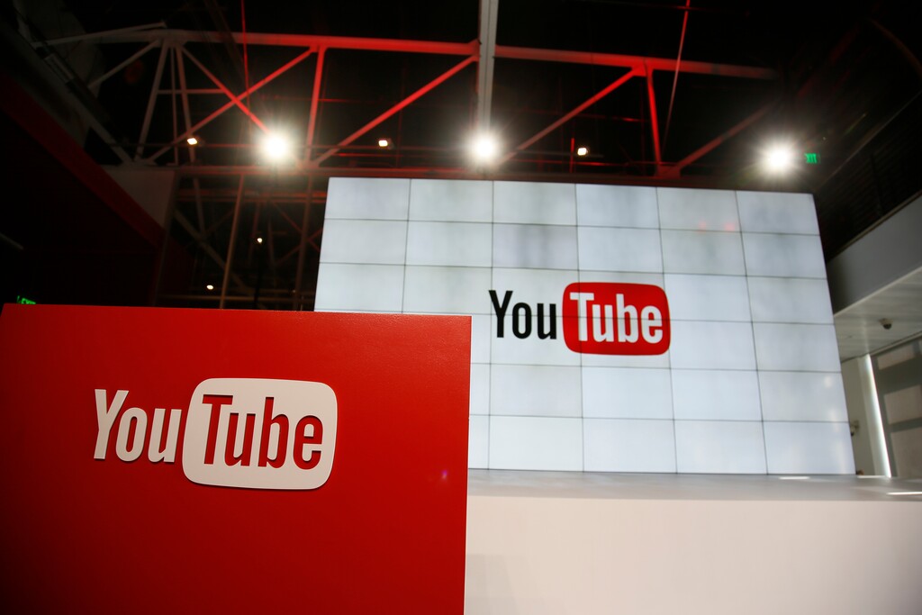 FILE - This Oct. 21, 2015, file photo shows signage inside the YouTube Space LA offices in Los Angeles.YouTube says it’s cracking down on conspiracy videos, though it’s scant on the details. YouTube CEO Susan Wojcicki said at a conference on Tuesday, March 13, 2018, that the company will work to debunk videos espousing conspiracy theories by including links to the online encyclopedia Wikipedia. (AP Photo/Danny Moloshok, File)