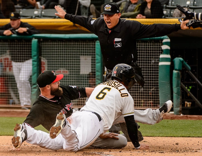 (Trent Nelson | The Salt Lake Tribune)  Salt Lake Bees vs. Albuquerque Isotopes, Triple-A baseball in Salt Lake City, Thursday April 5, 2018. Salt Lake's Michael Hermosillo (6) steals home as Albuquerque's DJ Johnson rushes in.
