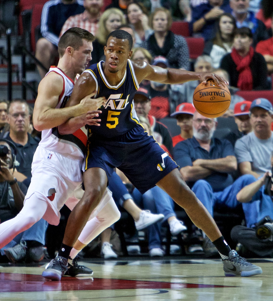Utah Jazz guard Rodney Hood, right, posts up against Portland Trail Blazers guard Pat Connaughton during the first half of an NBA preseason basketball game in Portland, Ore., Sunday, Oct. 18, 2015. (AP Photo/Craig Mitchelldyer)