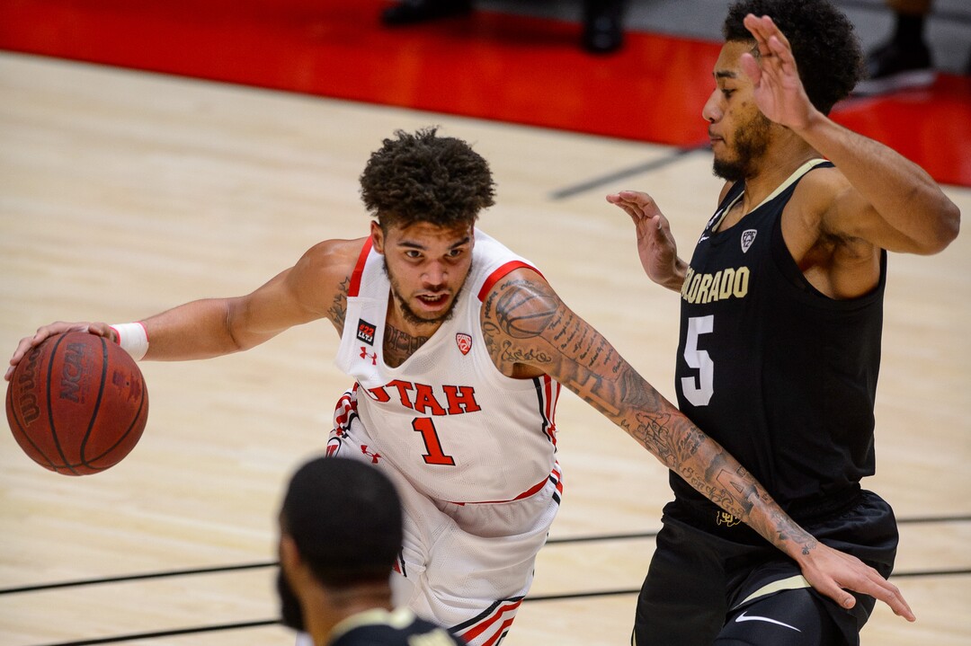 (Trent Nelson  |  The Salt Lake Tribune) Utah Utes forward Timmy Allen (1) drives on Colorado Buffaloes guard D'Shawn Schwartz (5) as Utah hosts Colorado, NCAA basketball in Salt Lake City on Monday, Jan. 11, 2021.