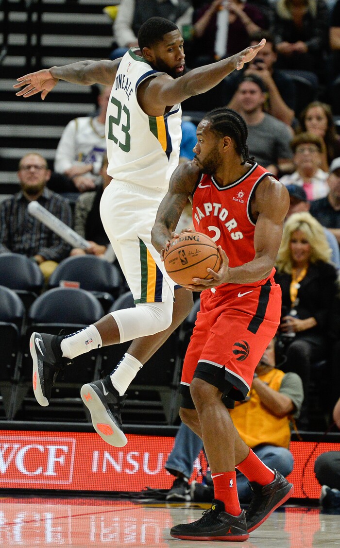 (Francisco Kjolseth  |  The Salt Lake Tribune)  Utah Jazz forward Royce O'Neale (23) tries to defend Toronto Raptors forward Kawhi Leonard (2) in the first half of the preseason NBA game at Vivint Smart Home Arena Tuesday, Oct. 2, 2018, in Salt Lake City.