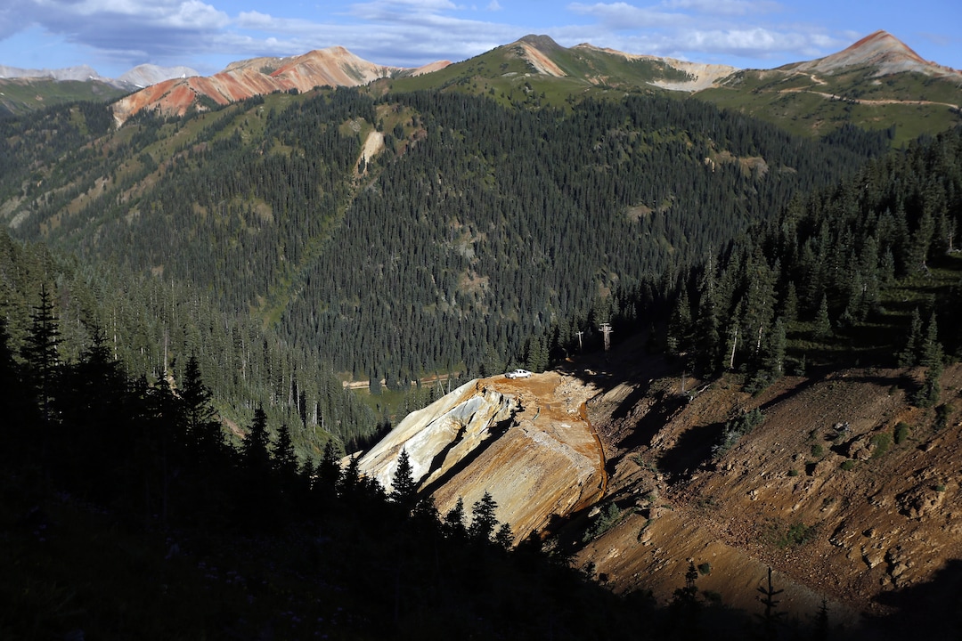 This Thursday, Aug. 13, 2015 photo shows the site of the blowout at the Gold King mine which triggered a major spill of toxic wastewater, outside Silverton, Colo. It will take years, if not decades, and many millions of dollars to clean up and manage the toxic wastewater from a this Colorado mine that unleashed a 100-mile-long torrent of heavy metals, affecting the livelihoods of residents in three states, according to some experts. (AP Photo/Brennan Linsley)