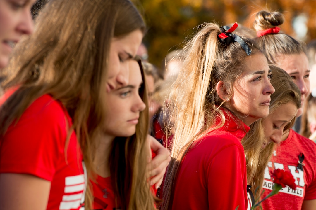 (Jeremy Harmon  |  The Salt Lake Tribune) Members of the University of Utah track team hold each other during a vigil for teammate Lauren McCluskey on Wed. Oct 24, 2018. McCluskey was killed on campus on Monday.