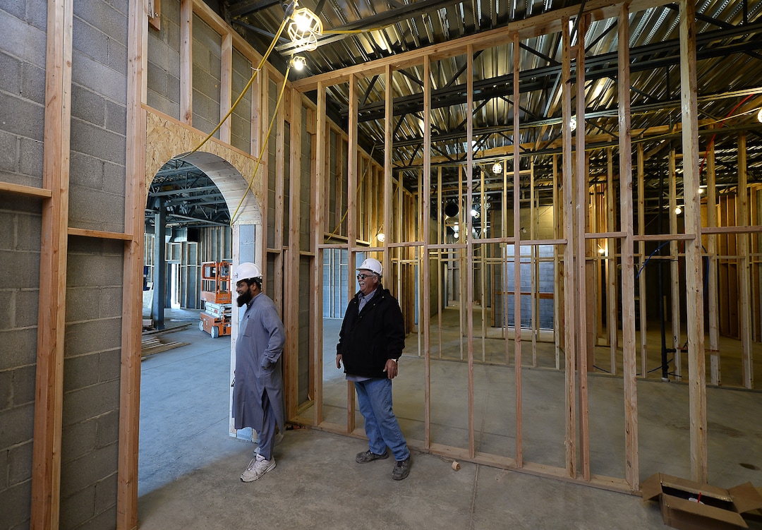 (Francisco Kjolseth  |  The Salt Lake Tribune)  Imam Shuaib Din is joined by superintendent Todd Burt as they tour the site of the half-finished mosque going up in West Jordan at 984 W 9000 South on Tuesday, Oct. 1, 2019. The bottom floor will consist of a multi-purpose room for overflow and rental space as a banquet hall.