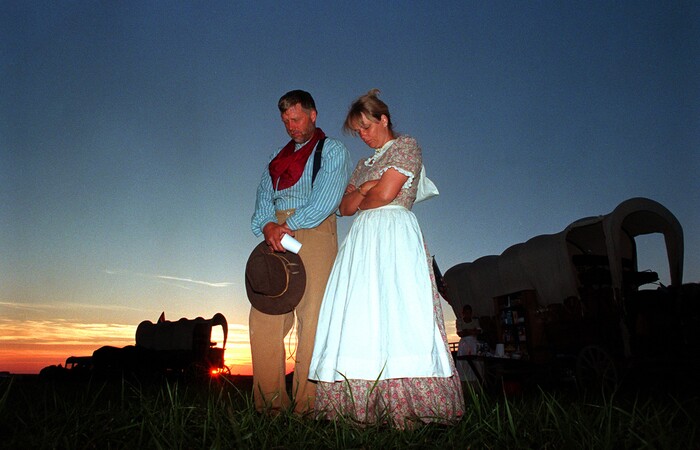 Rick Egan  |  Tribune File PhotoTom and Linda Whitaker bow their heads in prayer at Winter quarters.  
