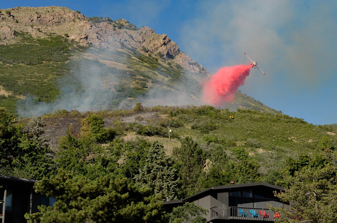 (Francisco Kjolseth  |  The Salt Lake Tribune) Fire crews battle a fire near Millcreek Canyon, on Saturday, July 11, 2020, started near 3400 South Crestwood Dr., as helicopters, single engine air tankers and multiple crews respond.