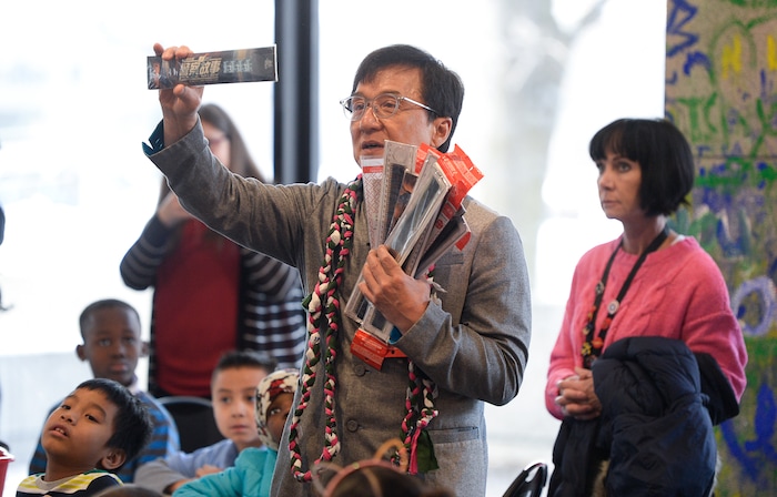 (Francisco Kjolseth | The Salt Lake Tribune) Jackie Chan meets with Mountain View Elementary students as he hands out rulers with an embedded strip of recycled film from one of his movies making every one unique during a workshop as part of a preview of Jackie ChanÕs Inaugural Environmental Exhibition ÔJackie Chan: Green HeroÕ at The Leonardo: Museum of Creativity and Innovation on Thursday, Jan. 24, 2019.