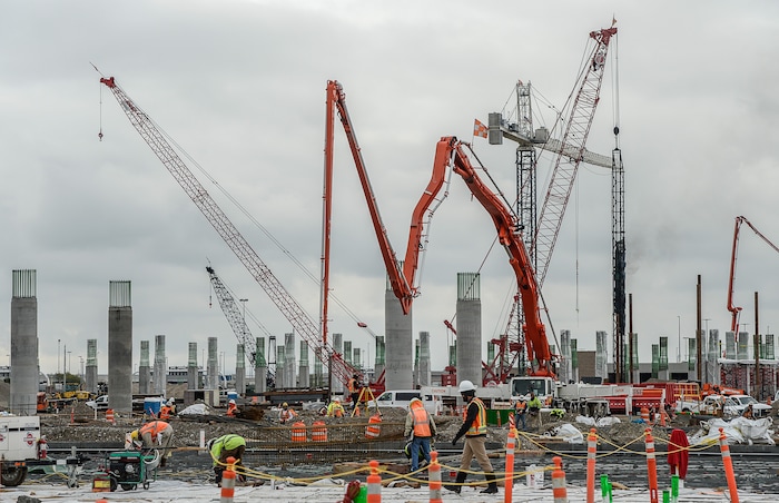 (Francisco Kjolseth  |  The Salt Lake Tribune)  A work force of 600 trade workers keep busy as the Salt Lake City Department of Airports gives a tour of the progress being made to replace the three aging terminals with a single central terminal building.  Over time, the existing terminal, parking garage and concourses will be completely demolished and replaced with a peak force of two thousands workers and an estimated completion date of 2025.