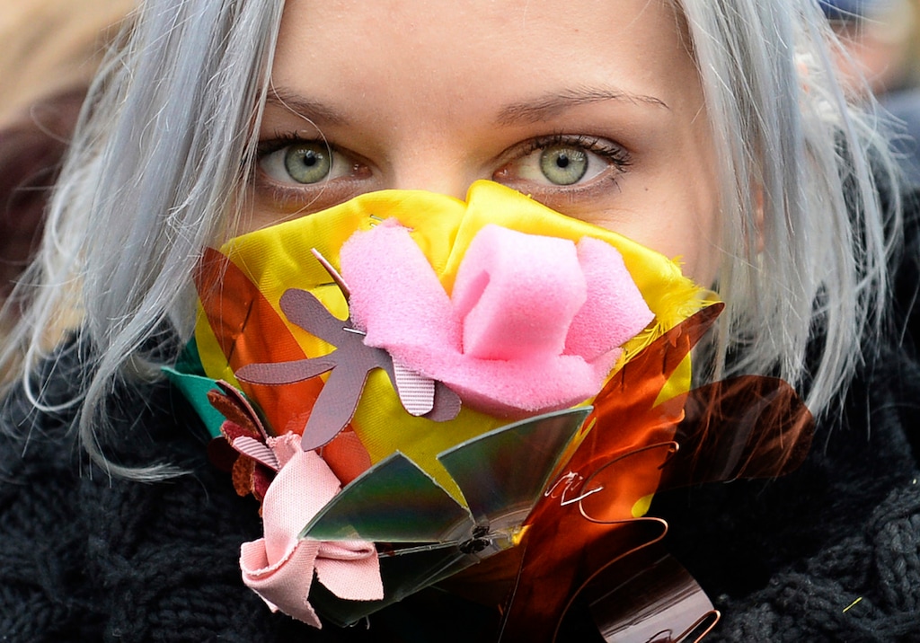 A climate activist with a colorful mask attends the March for Climate in a protest against global warming in Katowice, Poland, Saturday, Dec. 8, 2018, as the COP24 UN Climate Change Conference takes place in the city. (AP Photo/Alik Keplicz)