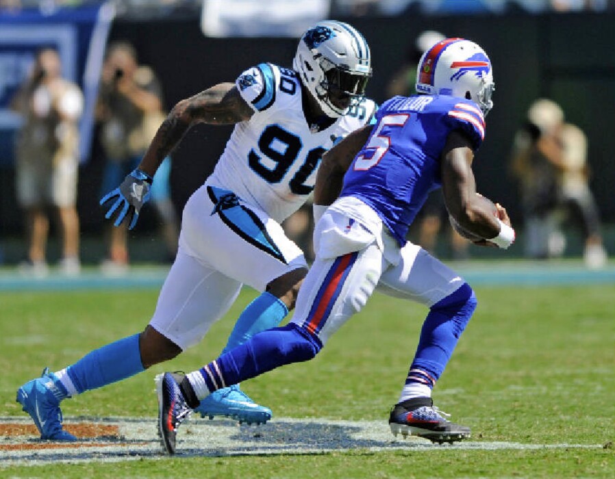 Mike McCarn | The Associated Press. Carolina Panthers' Julius Peppers (90) chases down Buffalo Bills' Tyrod Taylor (5) in the second half of an NFL football game in Charlotte, N.C., Sunday, Sept. 17, 2017.