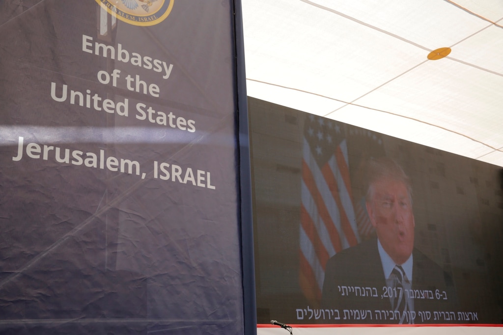 (AP Photo/Sebastian Scheiner) U.S. President Donald Trump is seen on screen as he delivers his speech during the opening ceremony of the new U.S. Embassy in Jerusalem, Monday, May 14, 2018.