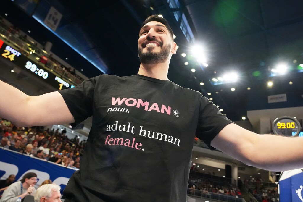 (Nam Y. Huh | AP) Former NBA center Enes Kanter Freedom greets a friend before a WNBA basketball game between the Indiana Fever and the Chicago Sky, Sunday, Aug. 23, 2026, in Chicago.