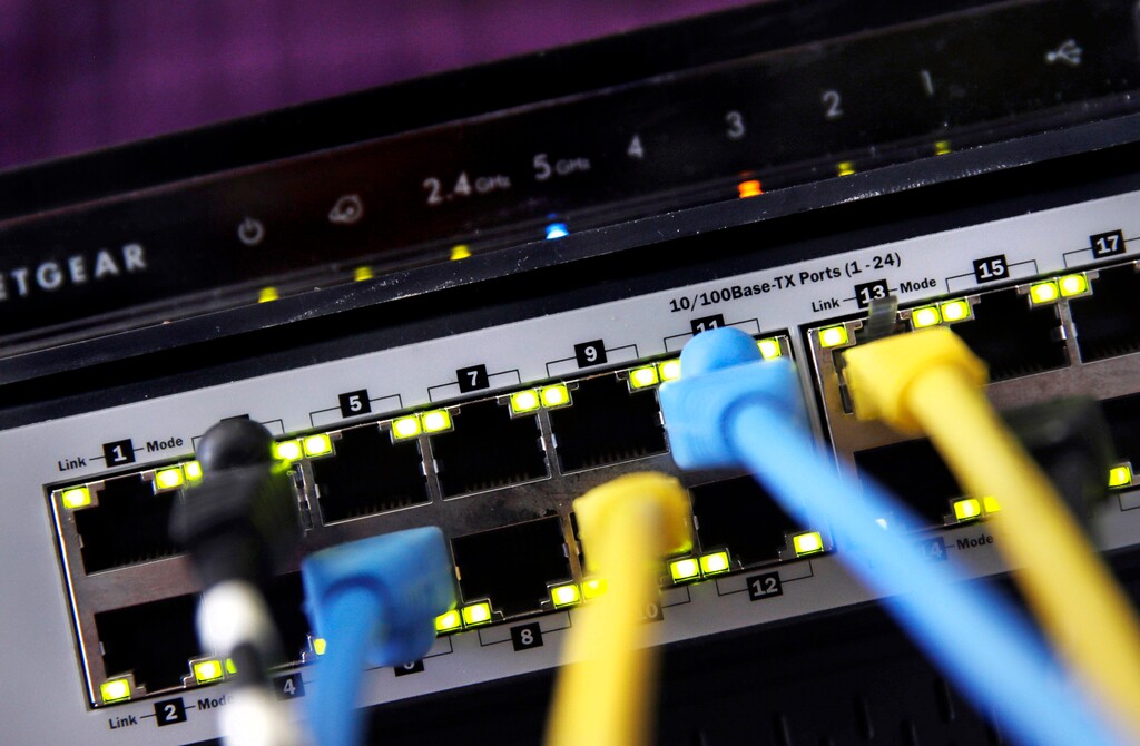 (Charles Krupa | The Associated Press) In this June 19 file photo, a router and internet switch are displayed in East Derry, N.H. Net neutrality traces back to an engineering maxim called the “end-to-end principle,” a self-regulating network that put control in the hands of end users rather than a central authority. Traditional cable-TV services, for instance, required special equipment and controlled what channels are shown on TV. With an end-to-end network like the internet, the types of equipment, apps, articles and video services permitted are limited only to imagination.